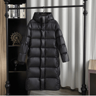 Damen lange schwarze Puffer Winterjacke mit Kapuze 